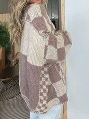 Oversized checkerboard knit cardigan in mocha and cream with a relaxed fit and dropped shoulders.