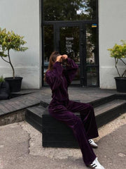 Plush velour lounge set in Violet, featuring wide leg pants and a zip-up jacket.