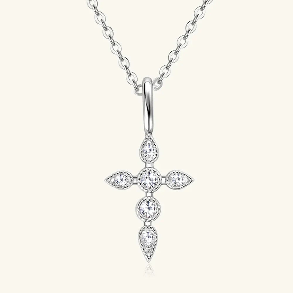 Silver diamond-set cross pendant necklace with a delicate chain.