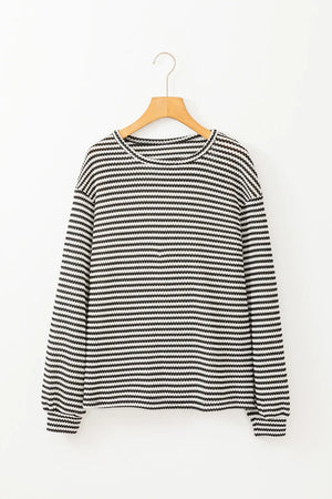 Black and white striped long sleeve tee with crew neck.