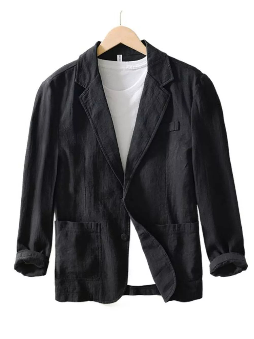 Black long sleeve blazer with lapel collar, two front pockets, and a single button closure, styled over a white t-shirt.