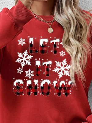 Red crewneck sweatshirt with "Let It Snow" graphic and buffalo plaid lettering.