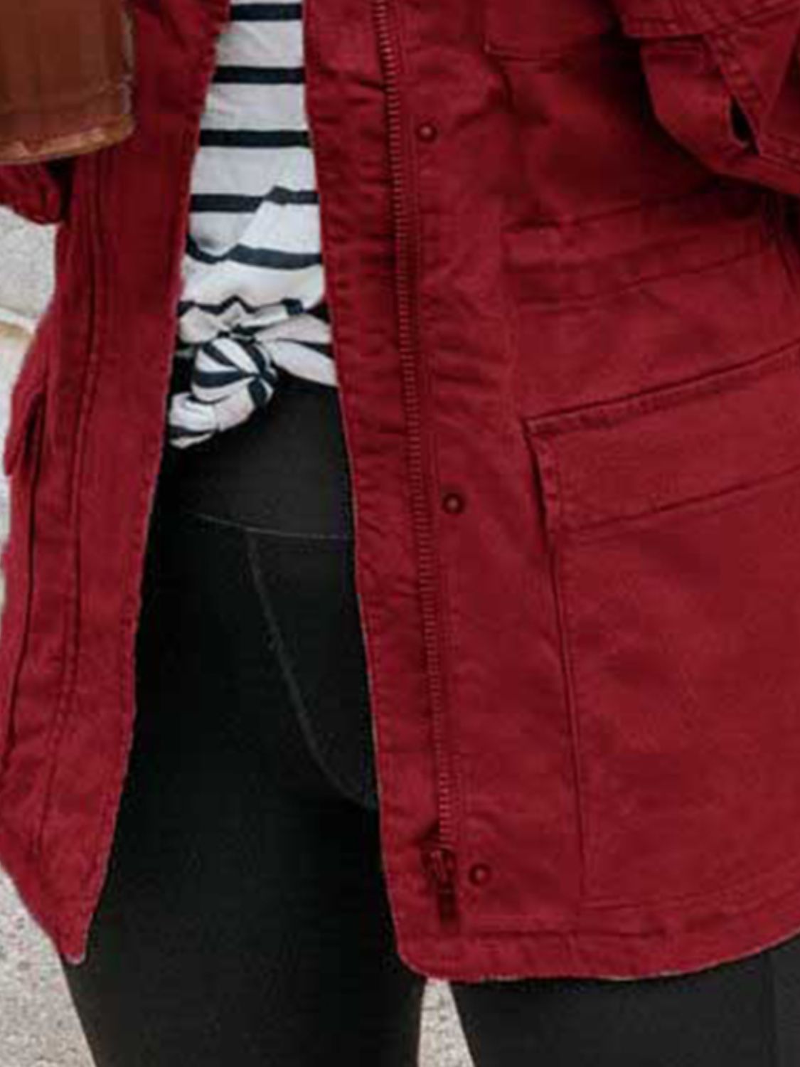 Rust utility jacket with zip and button closure, chest and hip pockets.