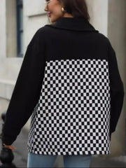Black button-up jacket with checkerboard panel detail