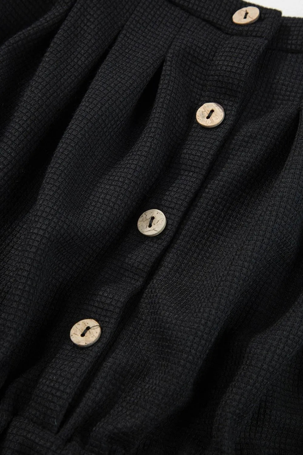 Black waffle knit jumpsuit with button detail