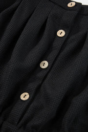 Black waffle knit jumpsuit with button detail