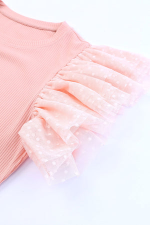 Blush pink ribbed knit blouse with sheer polka dot tulle ruffle sleeves.