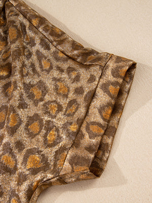 Brown leopard print button-down shirt with metallic sheen and classic collar detail.