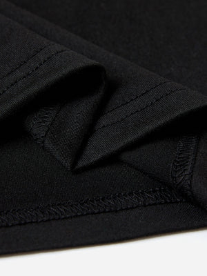 Black graphic tee showing fabric texture and stitching detail