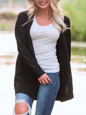 Black cable knit duster cardigan with textured details and ribbed cuffs.