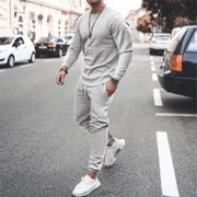 Men's gray textured loungewear set with crewneck sweatshirt and drawstring joggers.