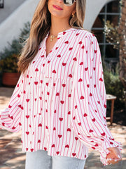 Maternity blouse with pink stripes and red hearts, button front, flounce sleeves.