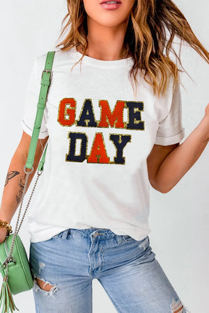 White graphic tee with sequin-trimmed GAME DAY lettering, crew neck, short sleeves.