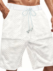 White quilted texture chino shorts with drawstring and diamond pattern detail.
