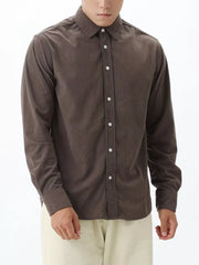 Brown corduroy long sleeve buttoned shirt with a spread collar.