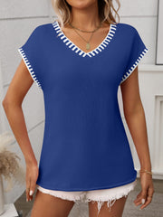 Royal blue knit v-neck sweater top with white contrast trim on neckline and sleeves.