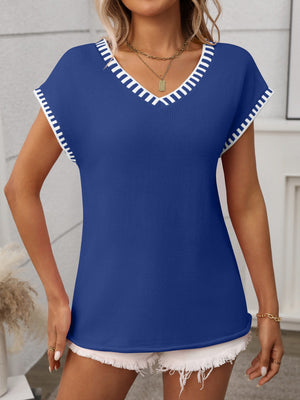 Royal blue knit v-neck sweater top with white contrast trim on neckline and sleeves.