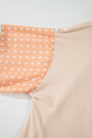 Patchwork sleeve blouse in Dust Storm with white polka dots on peach fabric.