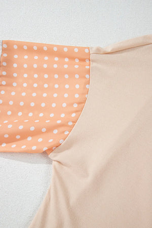 Patchwork sleeve blouse in Dust Storm with white polka dots on peach fabric.