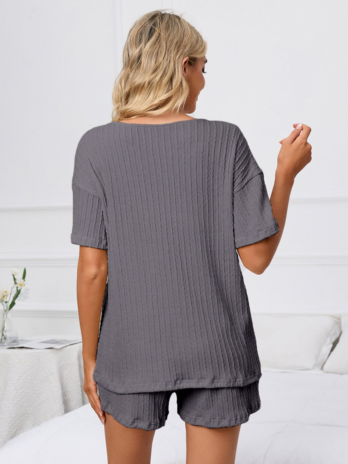 Dark gray ribbed knit pajama set with short sleeves and shorts.