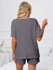 Dark gray ribbed knit pajama set with short sleeves and shorts.