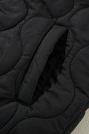 Black quilted hooded sleeveless jacket with a pocket detail
