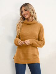 Textured knit oversized turtleneck pullover sweater in mustard yellow with ribbed details.