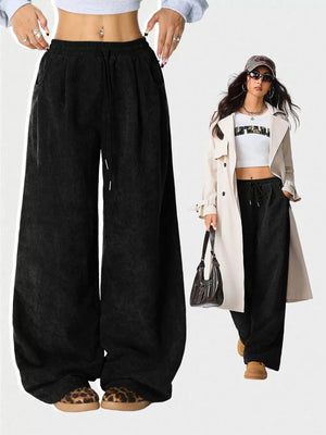 Black corduroy wide-leg maternity pants with drawstring waist and pockets.