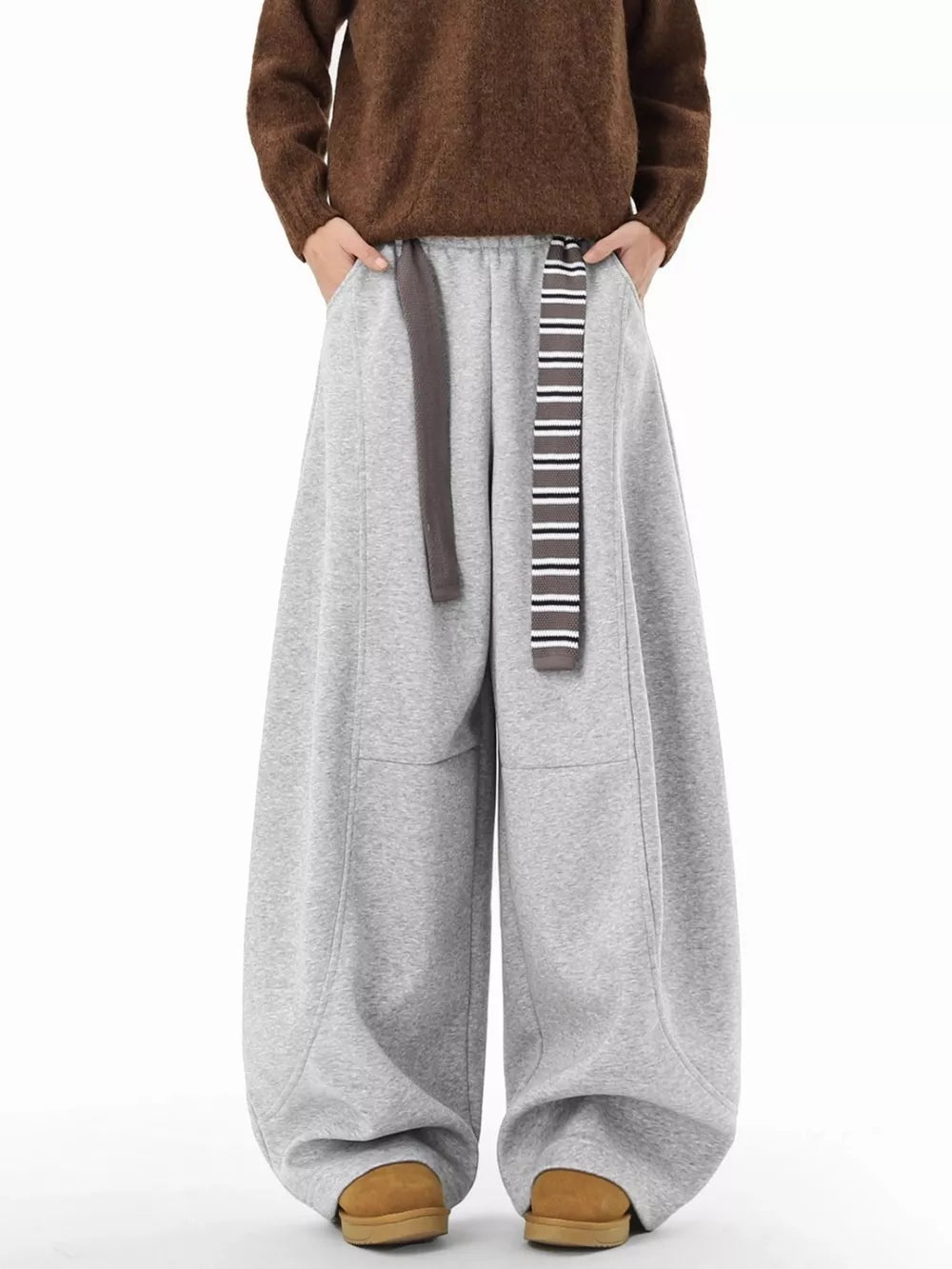 Grey ultra-comfort wide-leg men's sweatpants with drawstring and pockets.