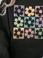 Black sweatshirt with retro floral square print in pastel colors.
