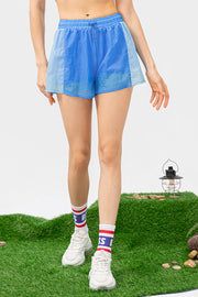 Colorblock running shorts in sky blue and light blue with drawstring waist.