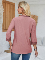 Dusty pink eyelet blouse with lace trim on neckline and sleeves.
