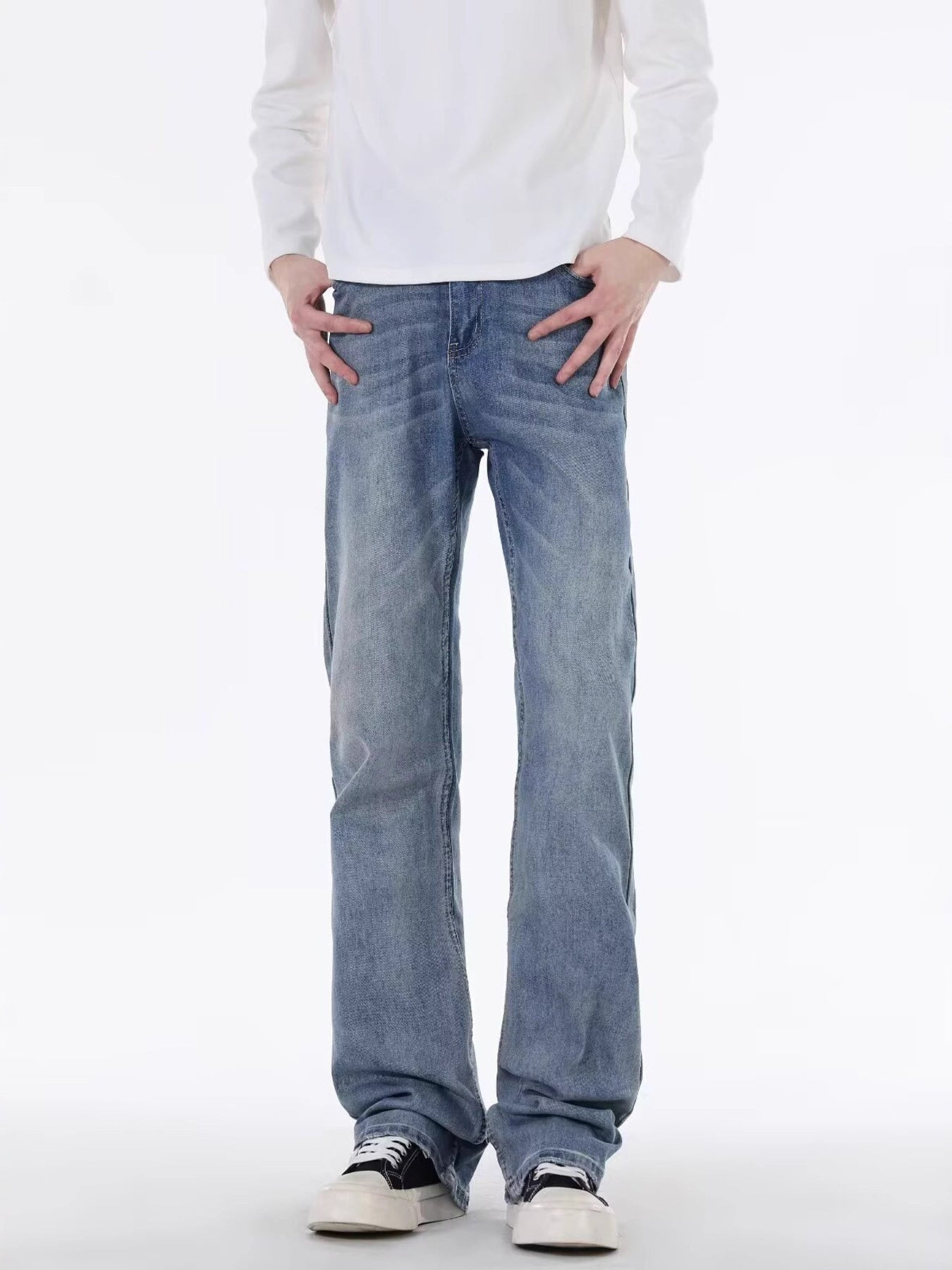 Men's classic blue cotton five-pocket jeans with a relaxed fit.