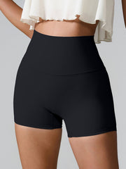 Black high-waisted active shorts with sculpted pocket detail