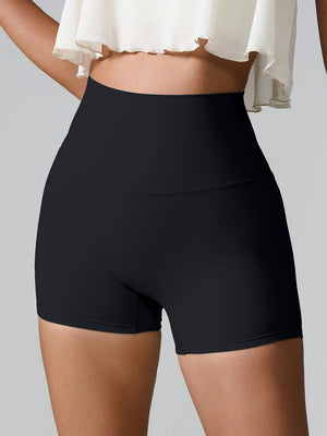 Black high-waisted active shorts with sculpted pocket detail
