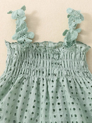 Green eyelet tank top with smocked bodice and floral straps