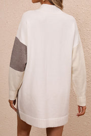 Geometric colorblock knit mini dress in ivory with camel and light blue sleeves.