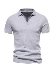 Men's light gray cotton blend polo shirt with notched collar and short sleeves.