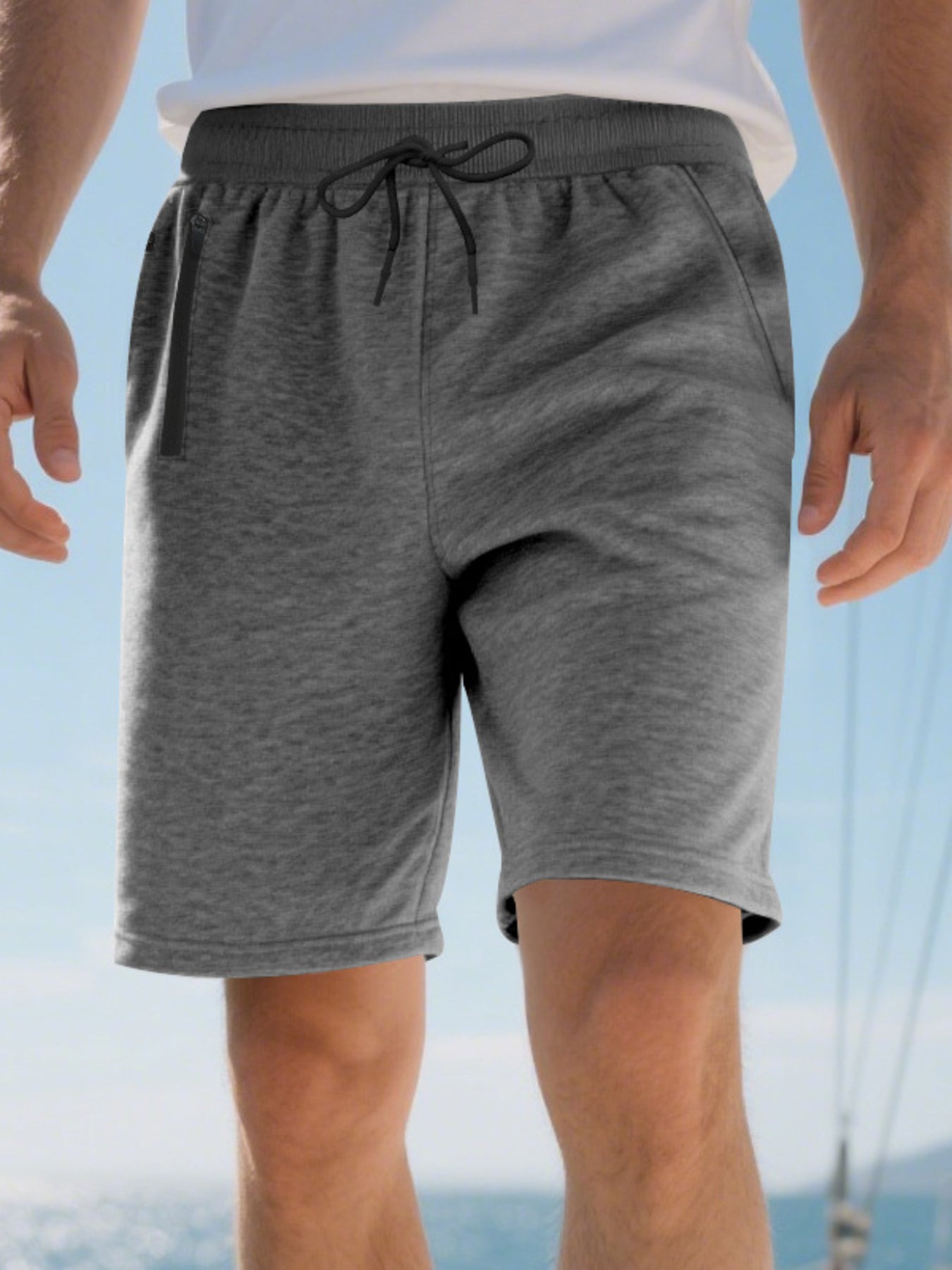 Men's dark gray casual shorts with drawstring waist and zip pocket detail.