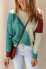Geometric colorblock knit sweater in multicolor with crew neck and long sleeves.