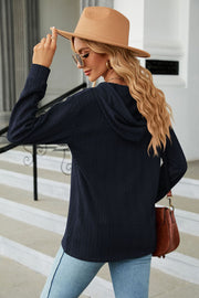 Dark Navy textured knit henley hoodie with a drawstring hood and long sleeves.