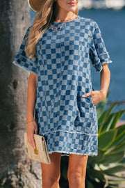 Checkered denim mini dress with frayed hems and short sleeves.