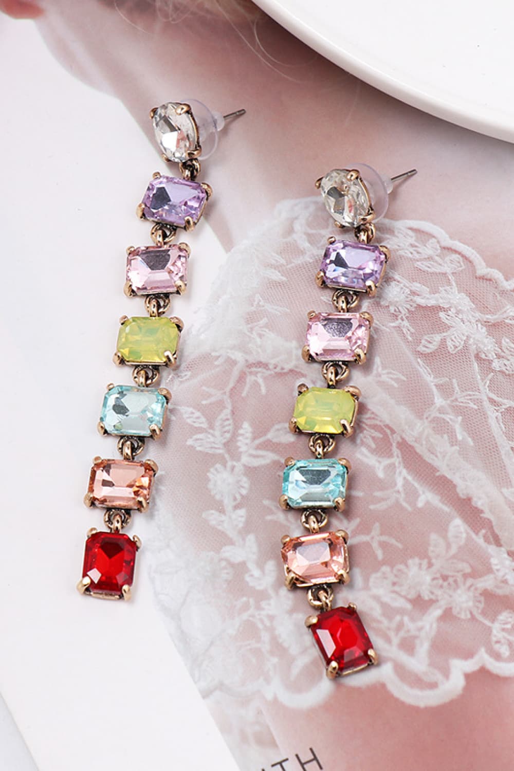 Ombre gemstone cascade earrings with multicolor square gems and gold alloy setting.
