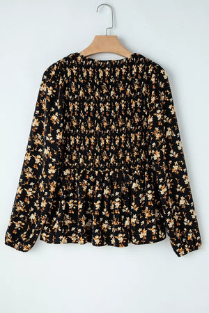 Black floral smocked waist long-sleeve blouse with peplum hem