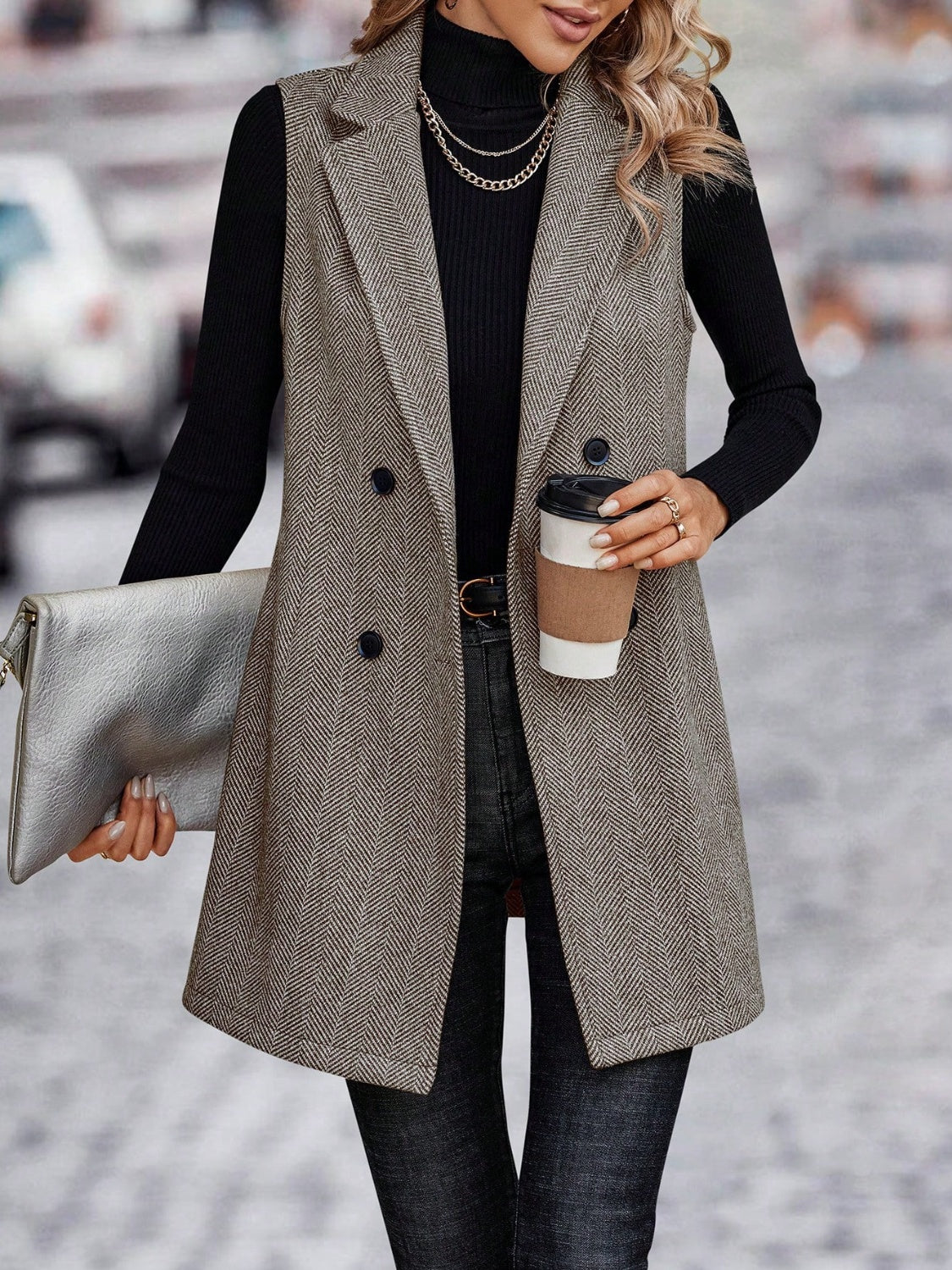 Herringbone tailored vest in taupe with double-breasted closure and collared neckline.