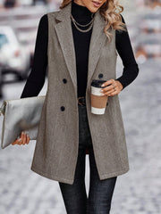 Herringbone tailored vest in taupe with double-breasted closure and collared neckline.