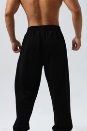 Black jogger trousers with elastic waistband and back pocket detail