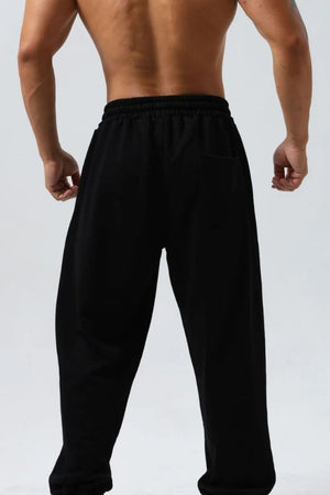 Black jogger trousers with elastic waistband and back pocket detail