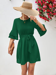 Forest green tiered sleeve mini dress with tie waist and A-line skirt.