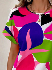 Women's abstract floral print t-shirt with short sleeves and a crew neck in vibrant pink, green, blue, and black.